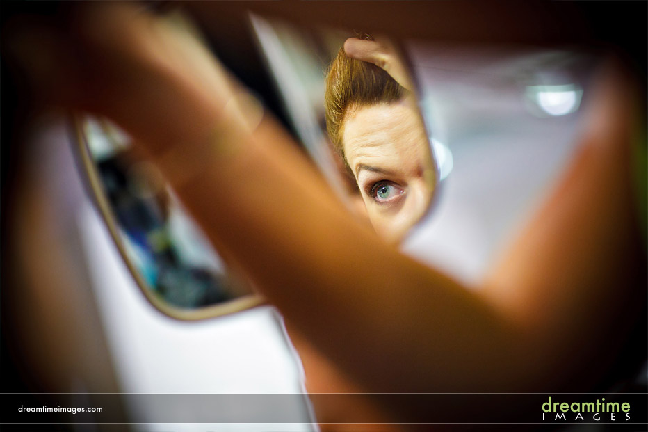 bride looking in mirror