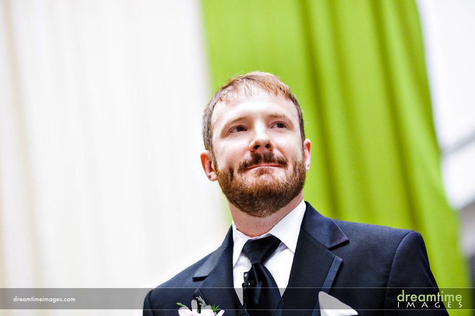 groom watching bride enter in denver