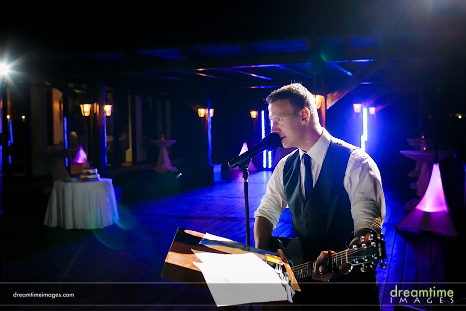 groom playing guitar