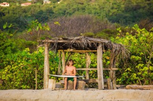 waxing a surfboard in Jaco