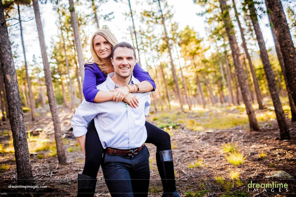 Backlit engagement photo in forest