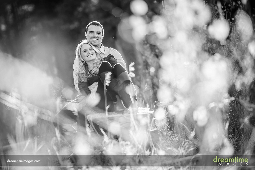 Couple holding each other in forest
